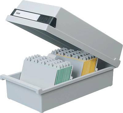 Grey index card box with an open lid, alphabetically sorted index cards in white, green, and yellow visible.