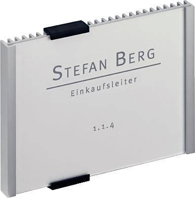 Name badge with the inscription 'Stefan Berg, Purchasing Manager, 1.1.4' on a metallic background.