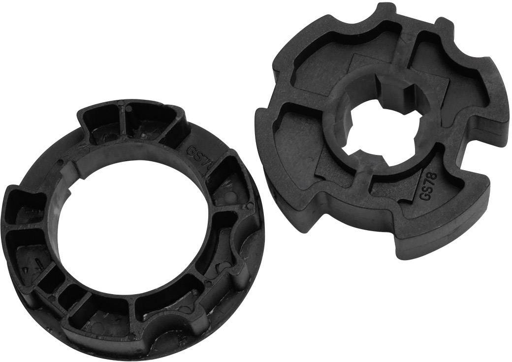 Two black plastic rings with different designs. One round and flat, the other intricately shaped and textured.