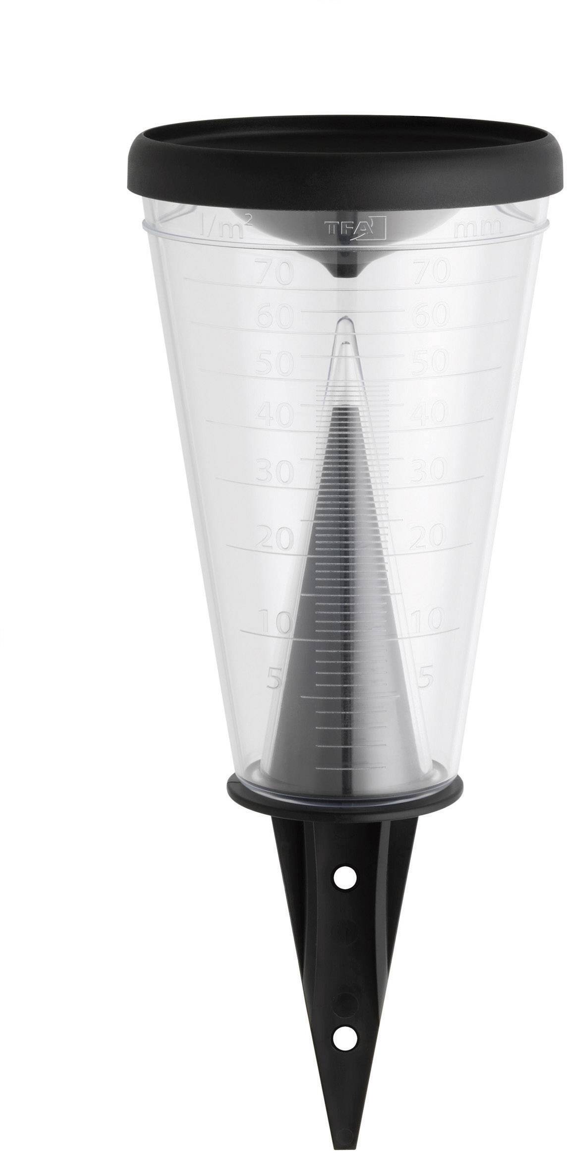 Rain gauge with black lid and ground spike, transparent container with scale for measuring precipitation levels.Rain gauge with a black lid and ground spike, a transparent vessel with a scale for measuring rainfall.