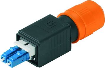 A rectangular black and orange connector with two blue connection pins, used for fibre optic cable connections.