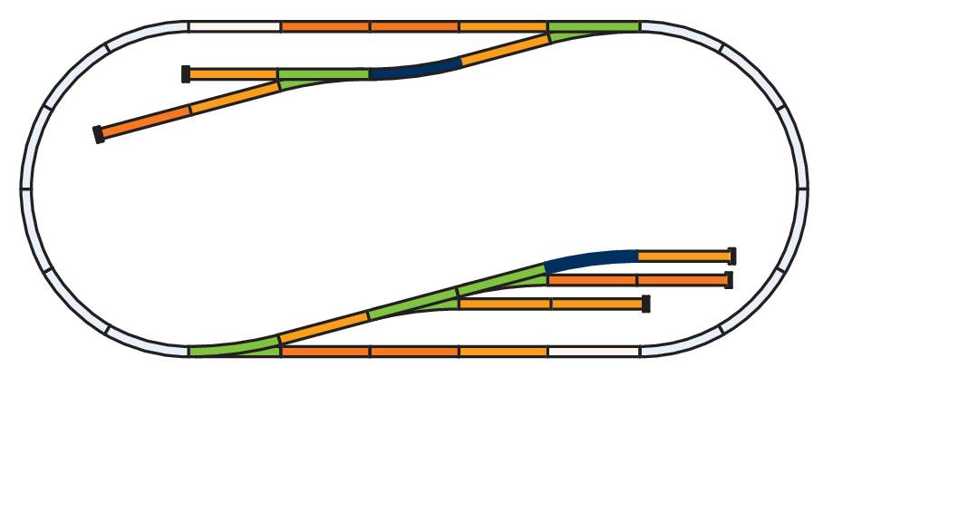 Diagram of a model railway track in an oval shape with multiple branches. The route runs on two levels.