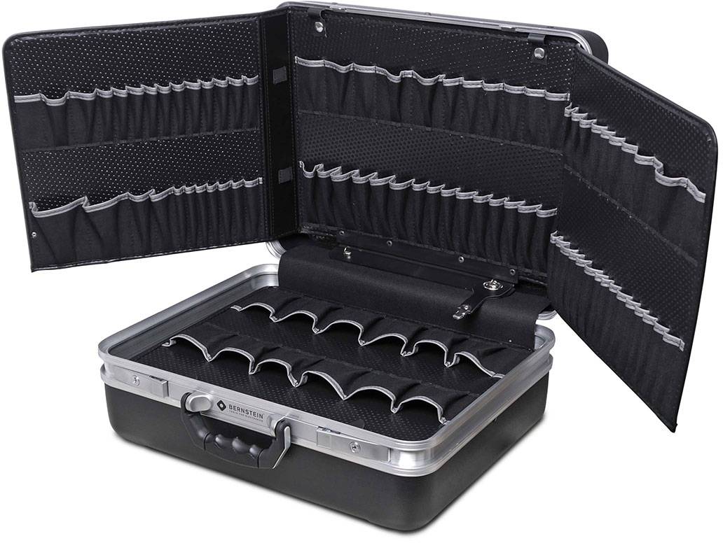 An open black suitcase with multiple rows of elastic holders in the lid and compartment dividers in the inner base area.