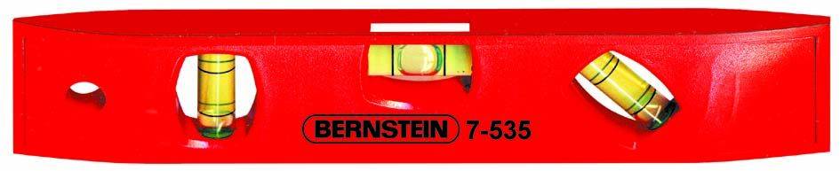 Red spirit level with three vials and the inscription 'Bernstein 7-535', for checking horizontal and vertical alignment.