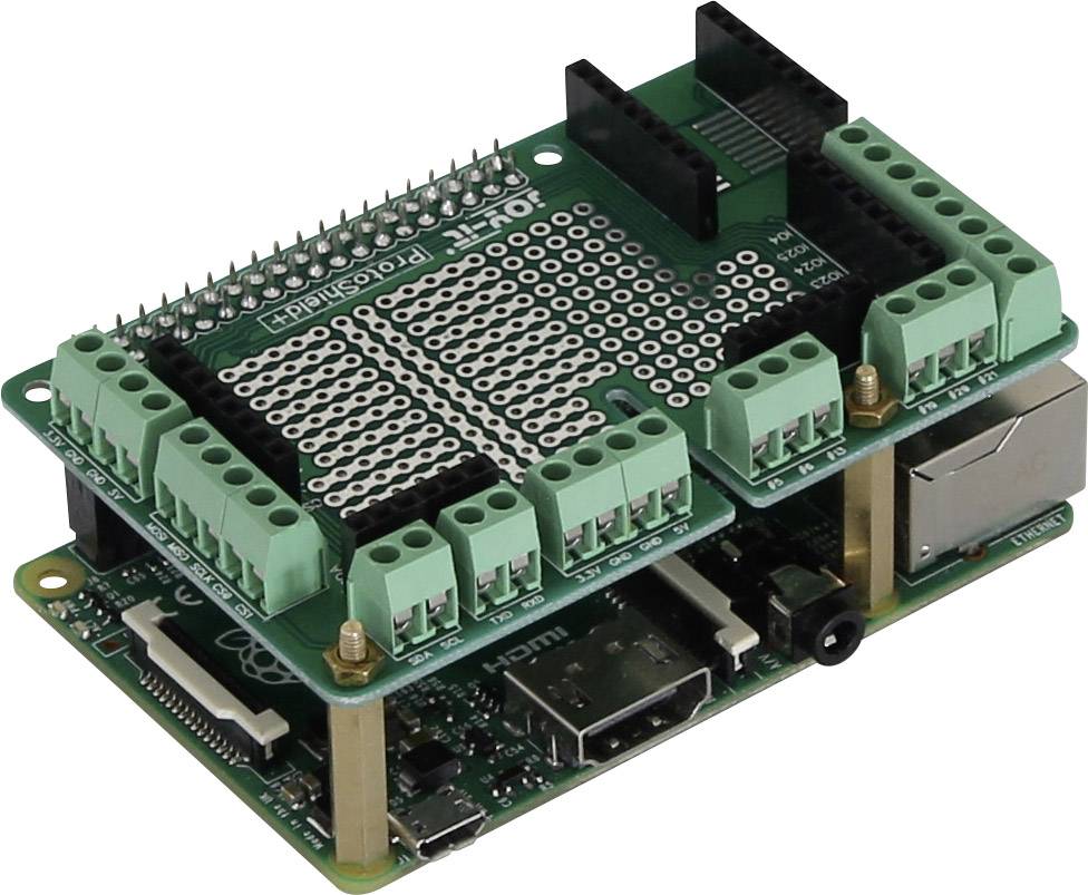 A green prototyping shield is installed on a Raspberry Pi. It has multiple connection terminals and pin rows for electronics projects.