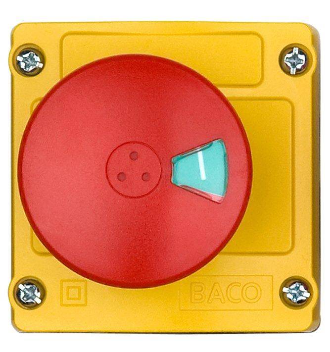 Yellow emergency switch with red rotary knob pointing to 'On'. Four screws secure the housing, brand name 'BACO' visible.