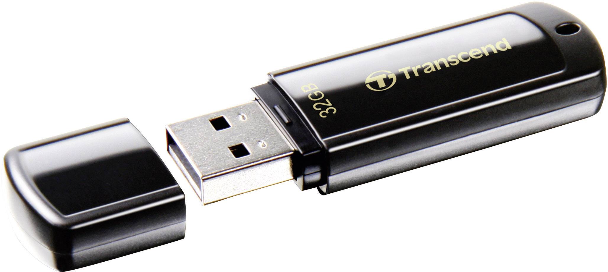 A black USB stick with the cap removed, 32 GB storage, brand 'Transcend'.