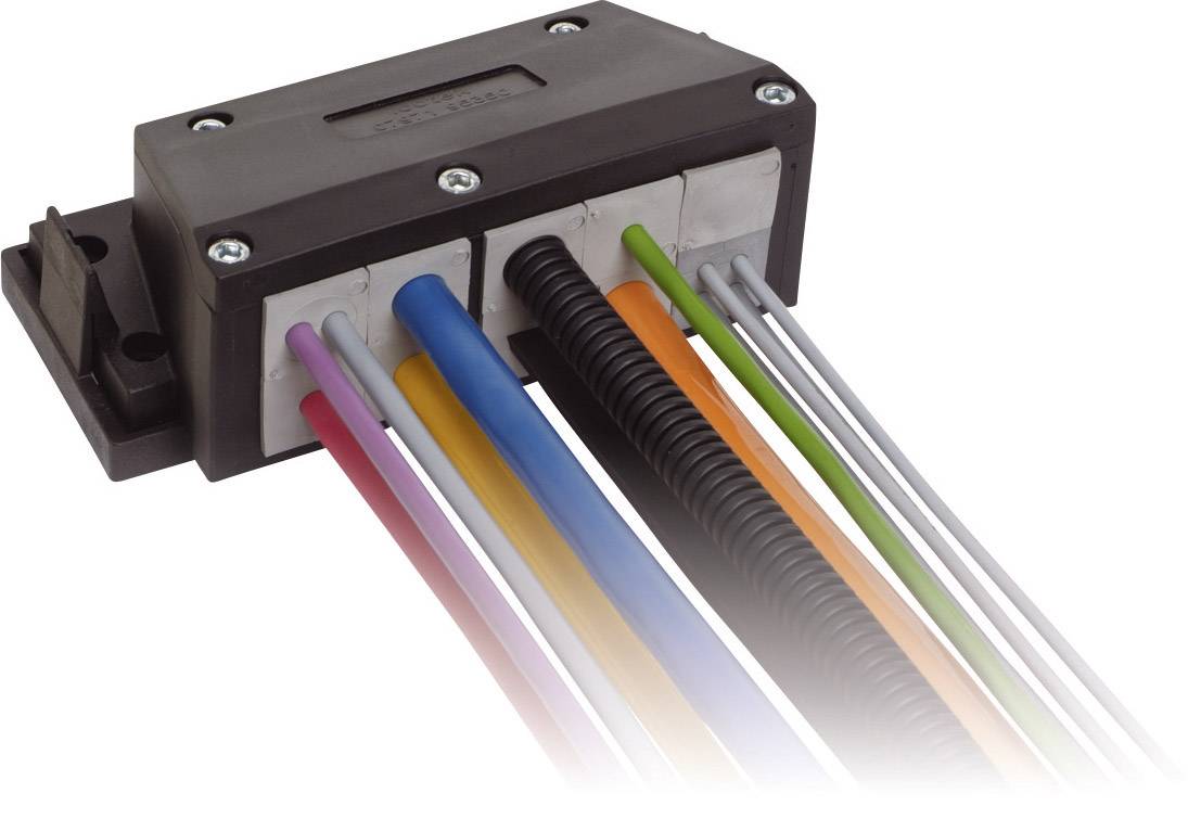 Cable grommet with multiple coloured cables in a protective cap, mounted on a surface. Suitable for organised cable routing.