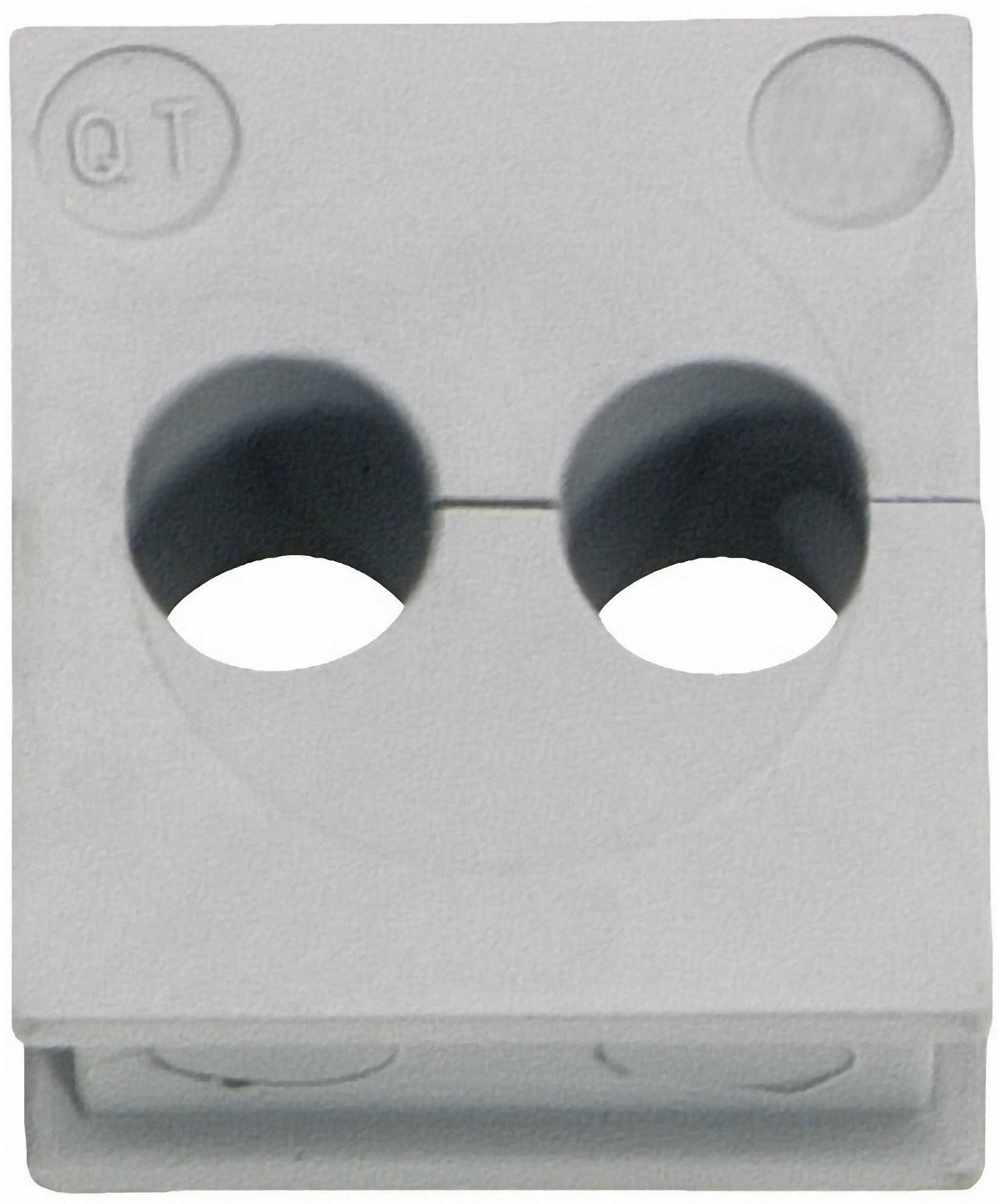 A white component with two round holes and the inscription 'QT' in the top left corner.