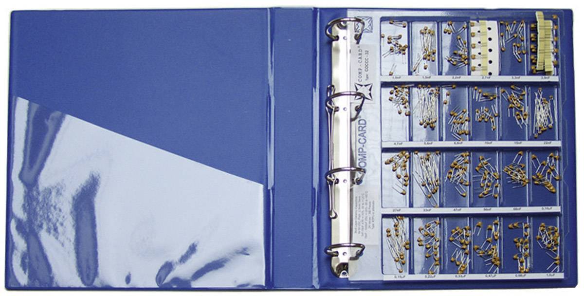Blue folder with removable dividers, filled with various electronic components such as resistors and capacitors.