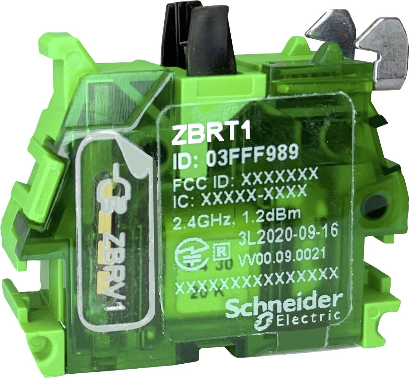 Green electronic device from Schneider Electric with inscription 'ZBRT1'. Contains ID 03FF989 and frequency specification 2.4GHz 1.2dBm.