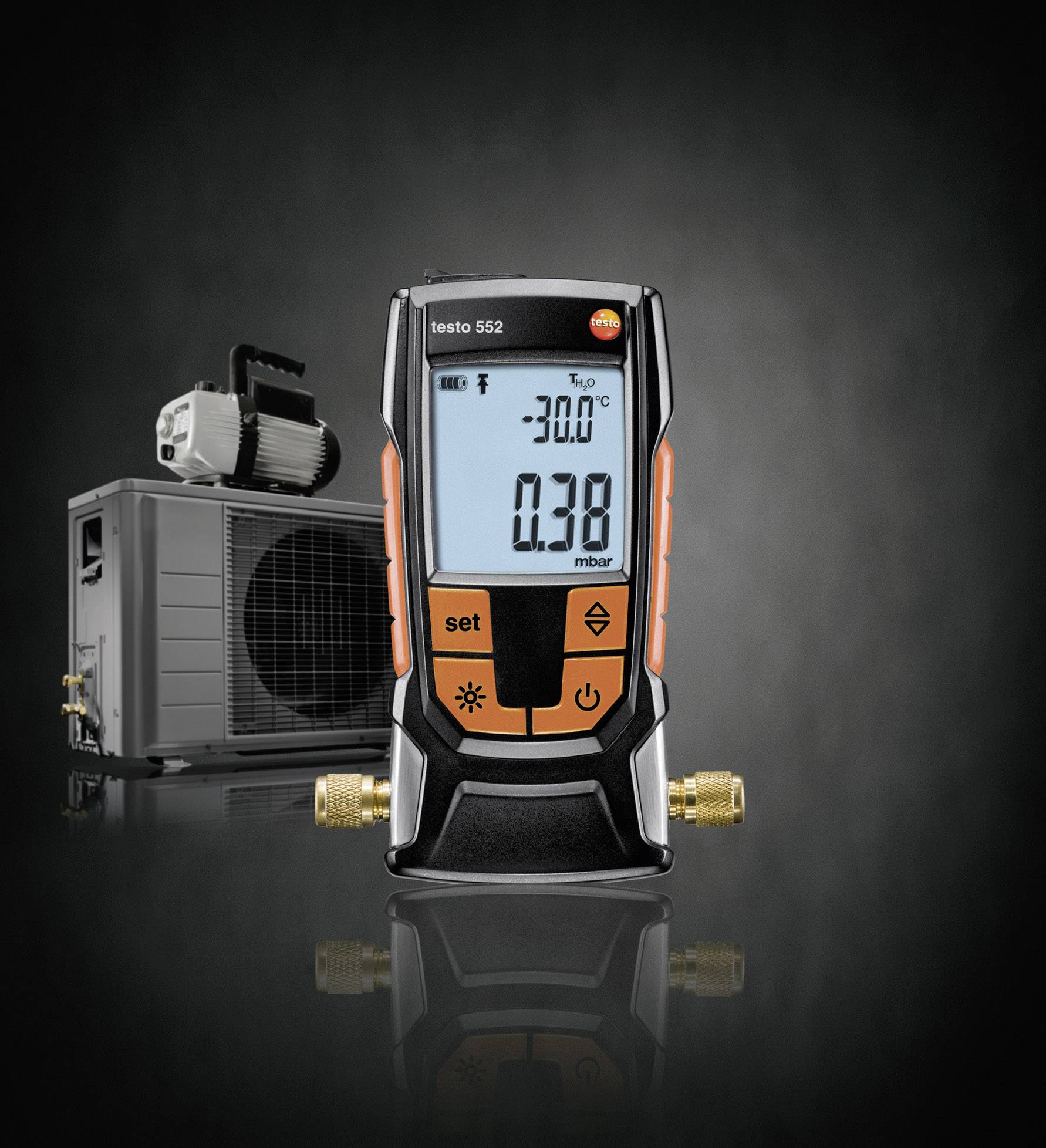 A digital vacuum measuring device stands in front of an air conditioning unit. The display shows '-20.0 °C' and '0.38 mbar'. Essential for HVAC system testing.