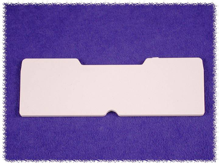 A blank, rectangular, white card lies on a purple background.