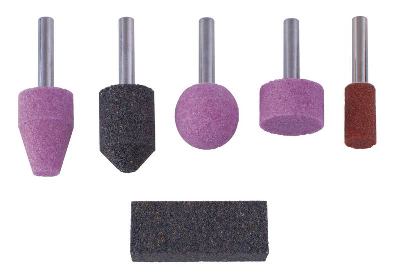 A set of five grinding stones in various shapes and colours, along with a rectangular grinding block, used for grinding purposes.
