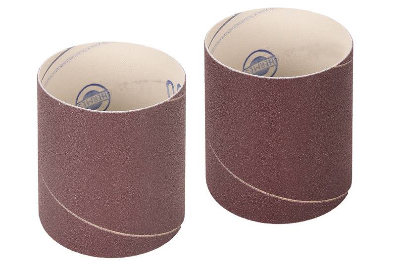 Two brown sandpaper rolls are standing side by side on a white background.
