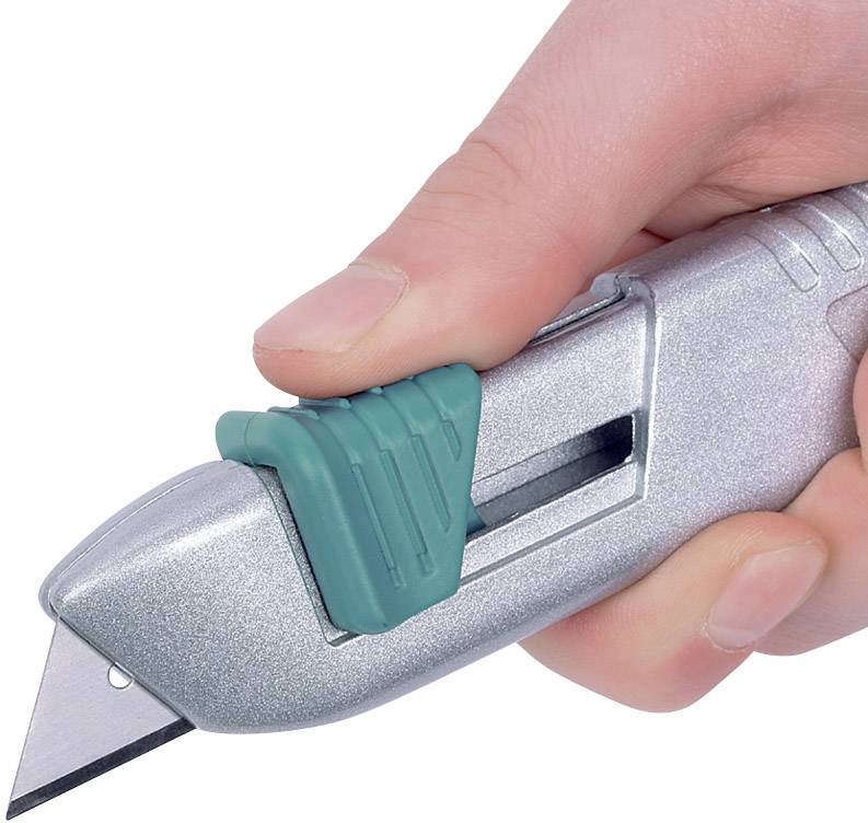 A hand is holding a silver carpet knife with a green handle, its blade protruding.