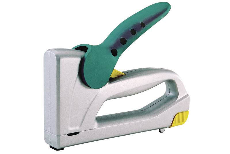 Silver stapler with a green handle and yellow accenting, lying on a white background.
