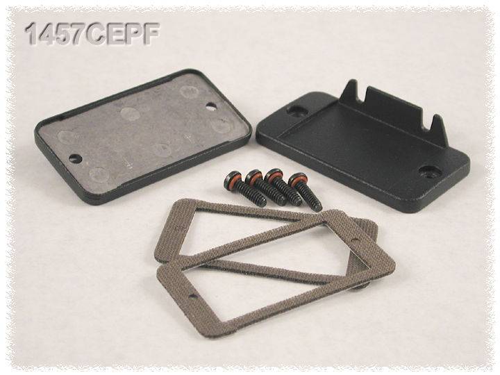 Rectangular housing lid, screws and seals on a light background.