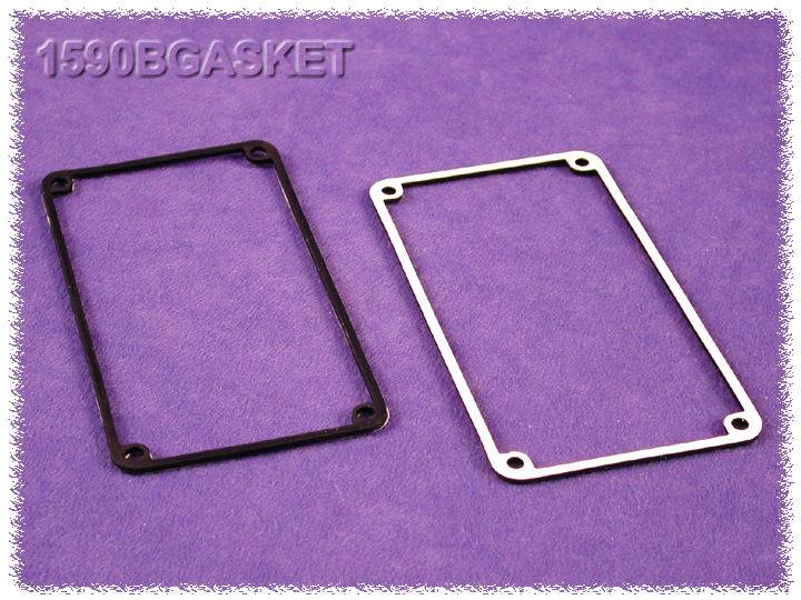 Two rectangular seals lie side by side on a violet background. One seal is black, the other white.
