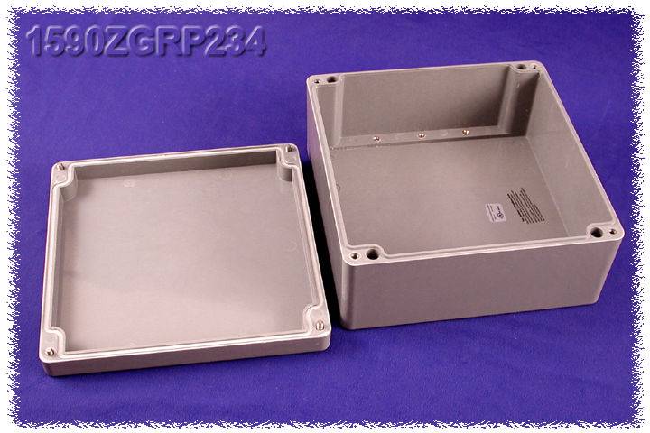 Plastic housing in two parts against a purple background. On the right is the base, on the left is the removed lid.
