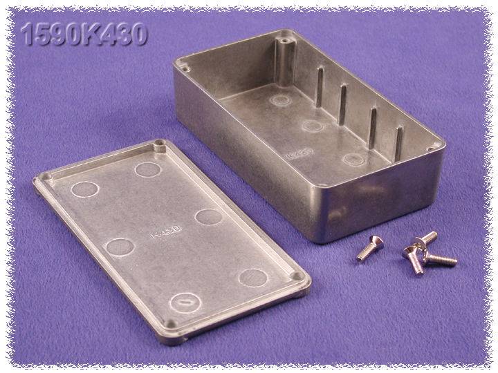 Metal enclosure with removed lid reveals interior and accompanying screws; text '1590K430' embossed.