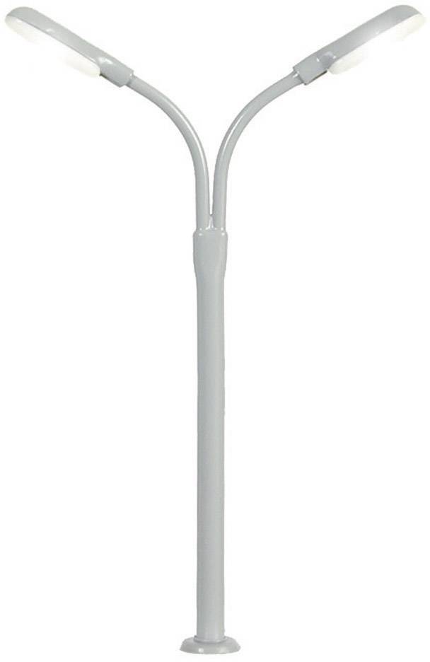Grey two-headed street lamp with curved arms extending outwards. Stands on a circular base.
