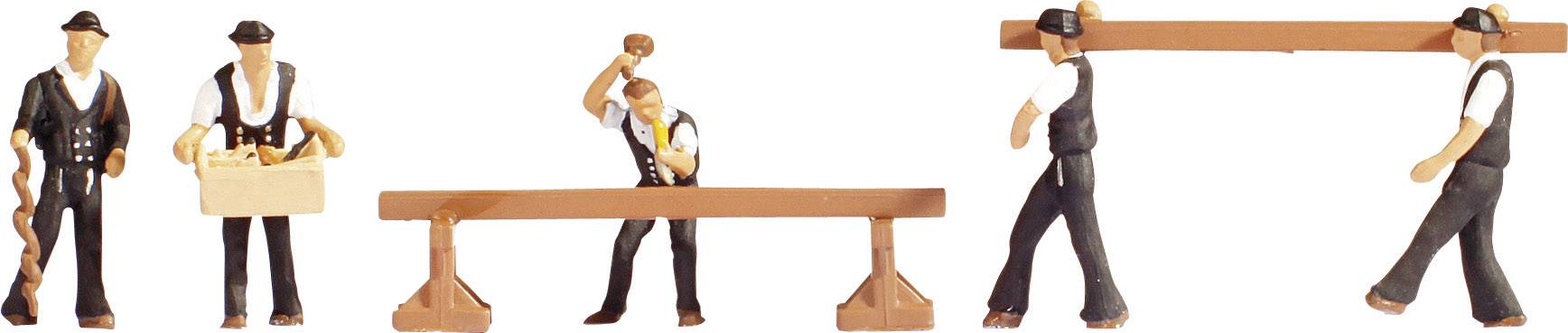 Tiny figurines depict carpenters at work: one is carrying a beam, another is sawing, and one is raising a hammer over a wooden workbench.