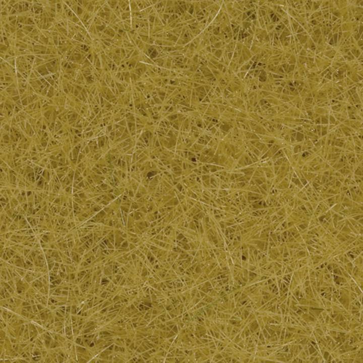 A close-up of a surface with dense, yellow, fibrous structures.