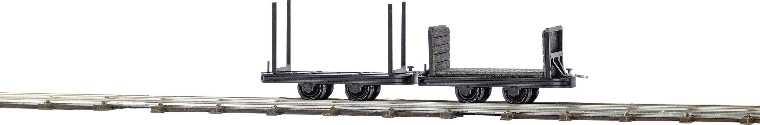 A small, empty model railway goods wagon on rails, without cargo or embellishments, against a white background.