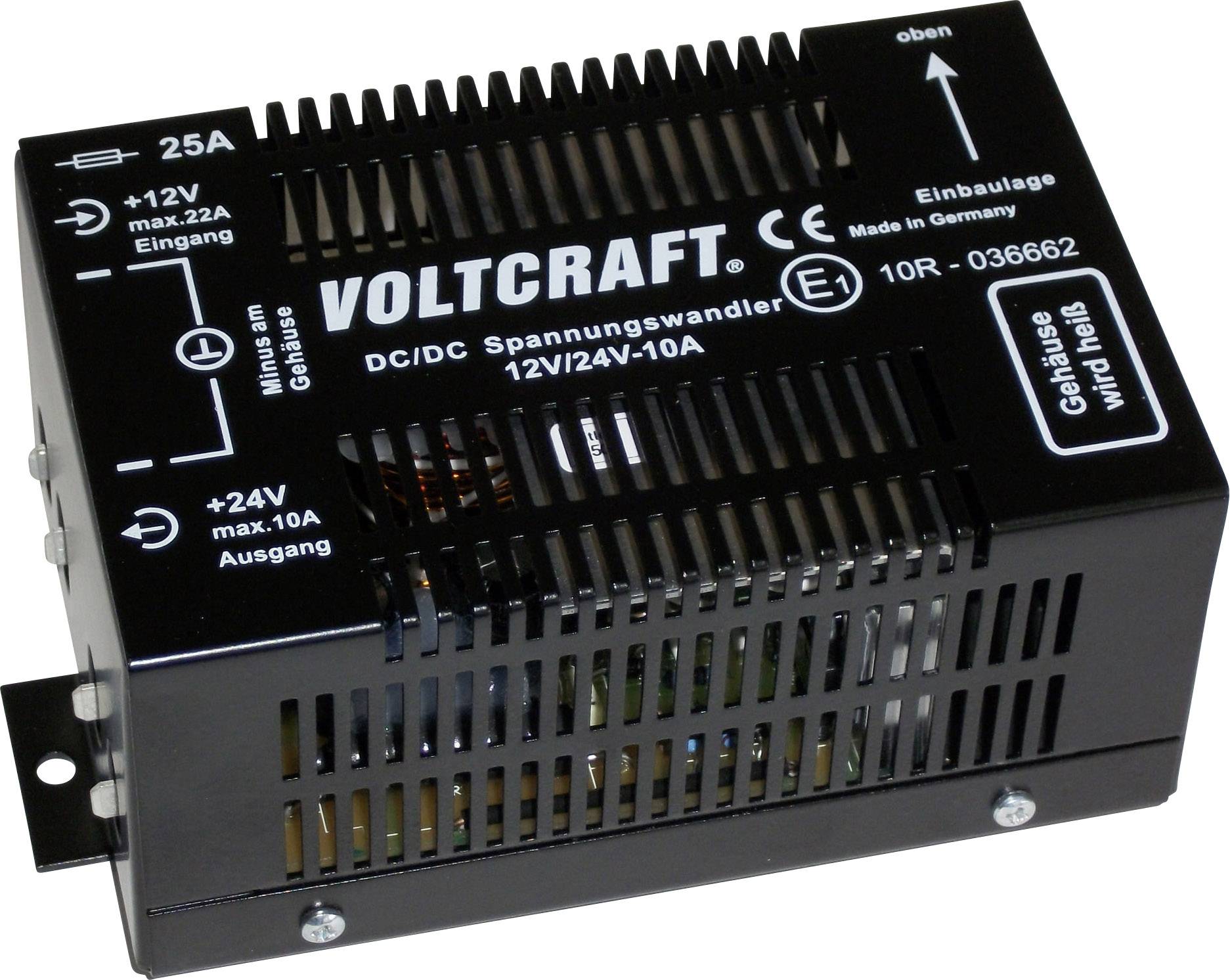 Voltage converter by Voltcraft, model 12V/24V-10A. Black casing with ventilation slots. Inputs and outputs clearly marked.