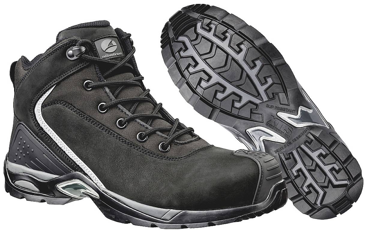 Black safety shoes with robust tread and protective toe area, suitable for work environments with high safety requirements.