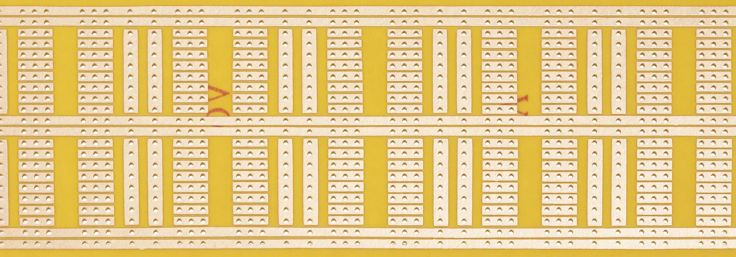 Electronic circuit with symmetrical lines and patterns on a yellow circuit board.