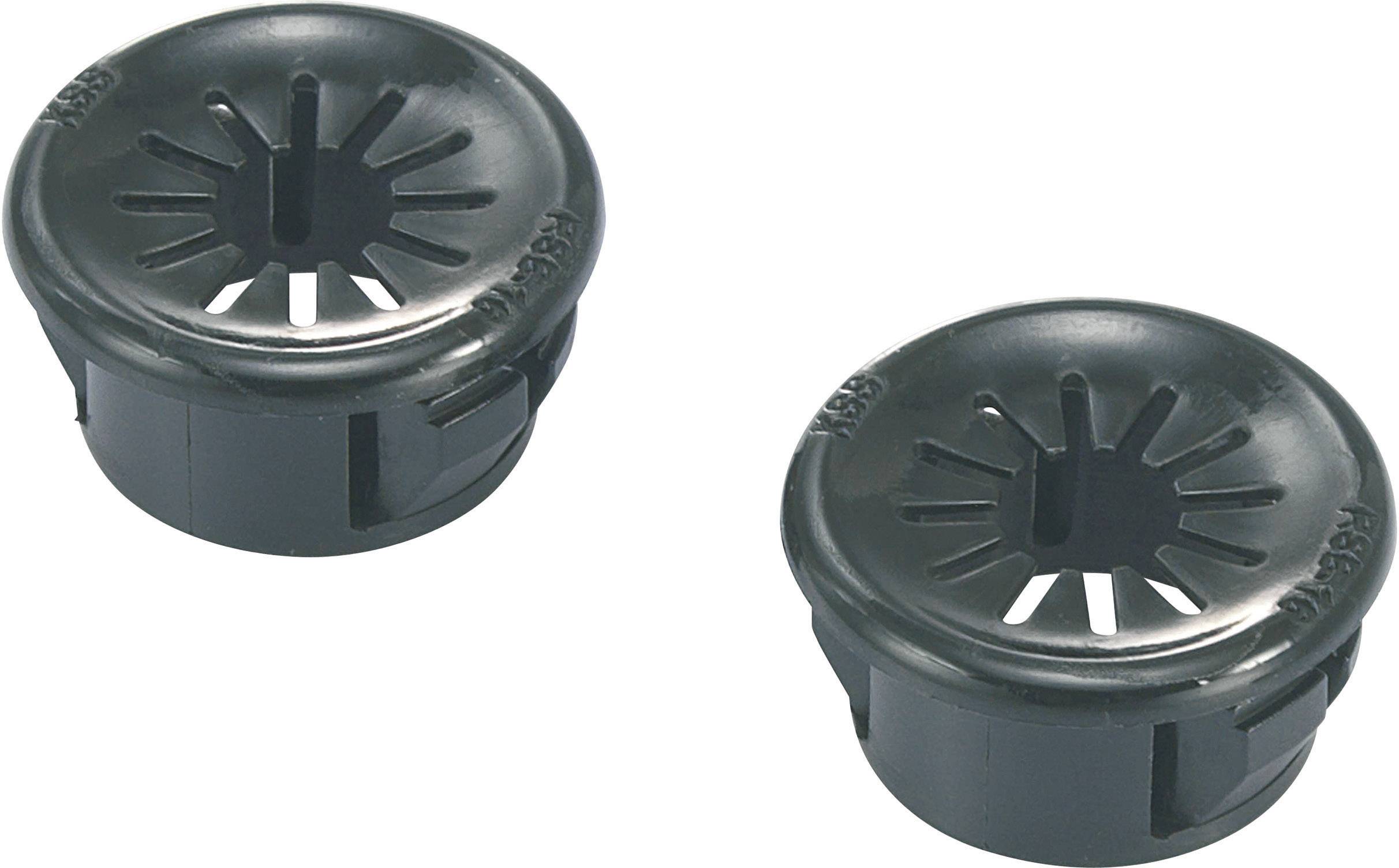 Two black, round plastic covers with star-shaped openings in the centre, possibly cable entry points.