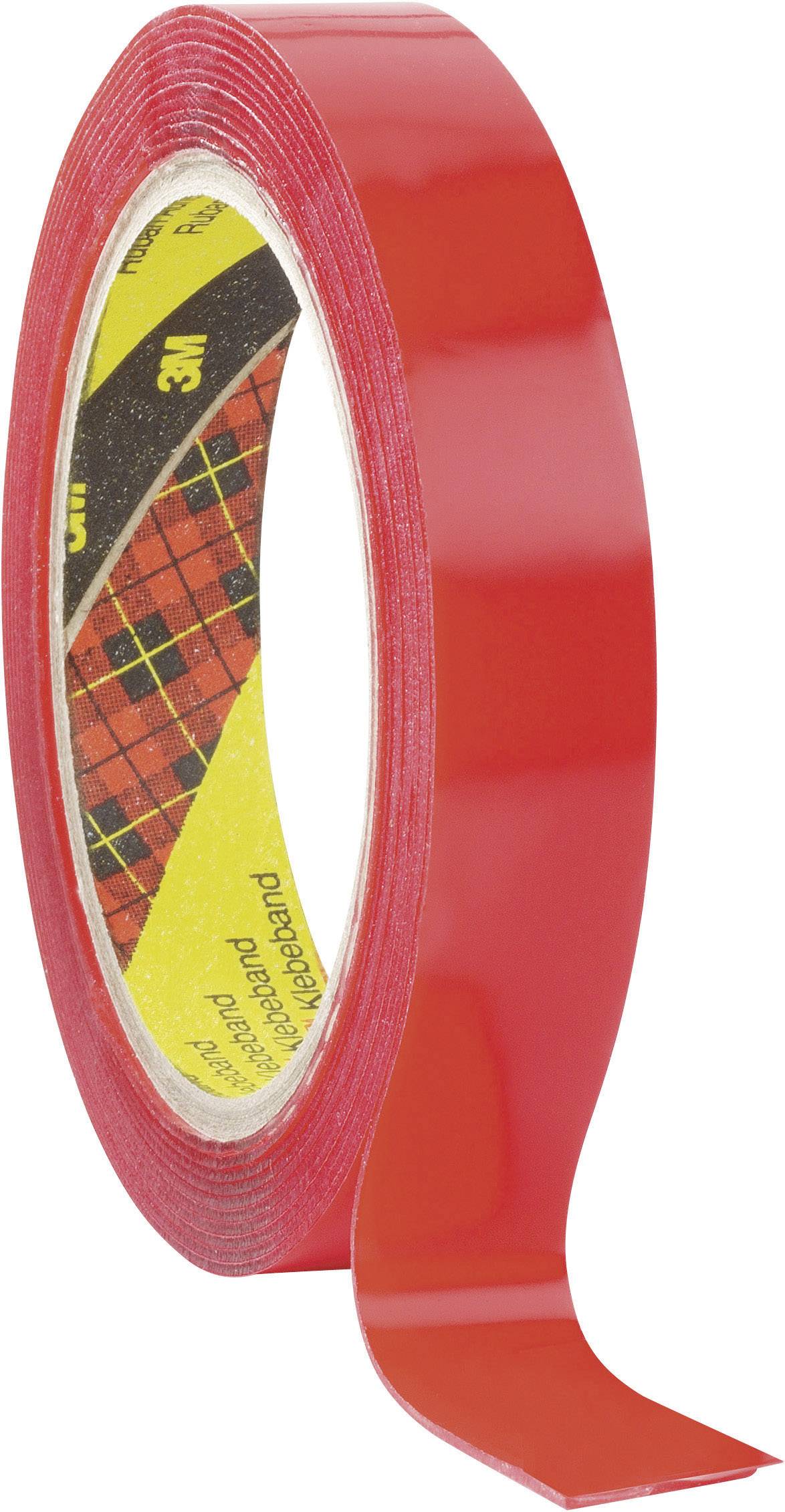 A roll of red adhesive tape, partially unrolled.
