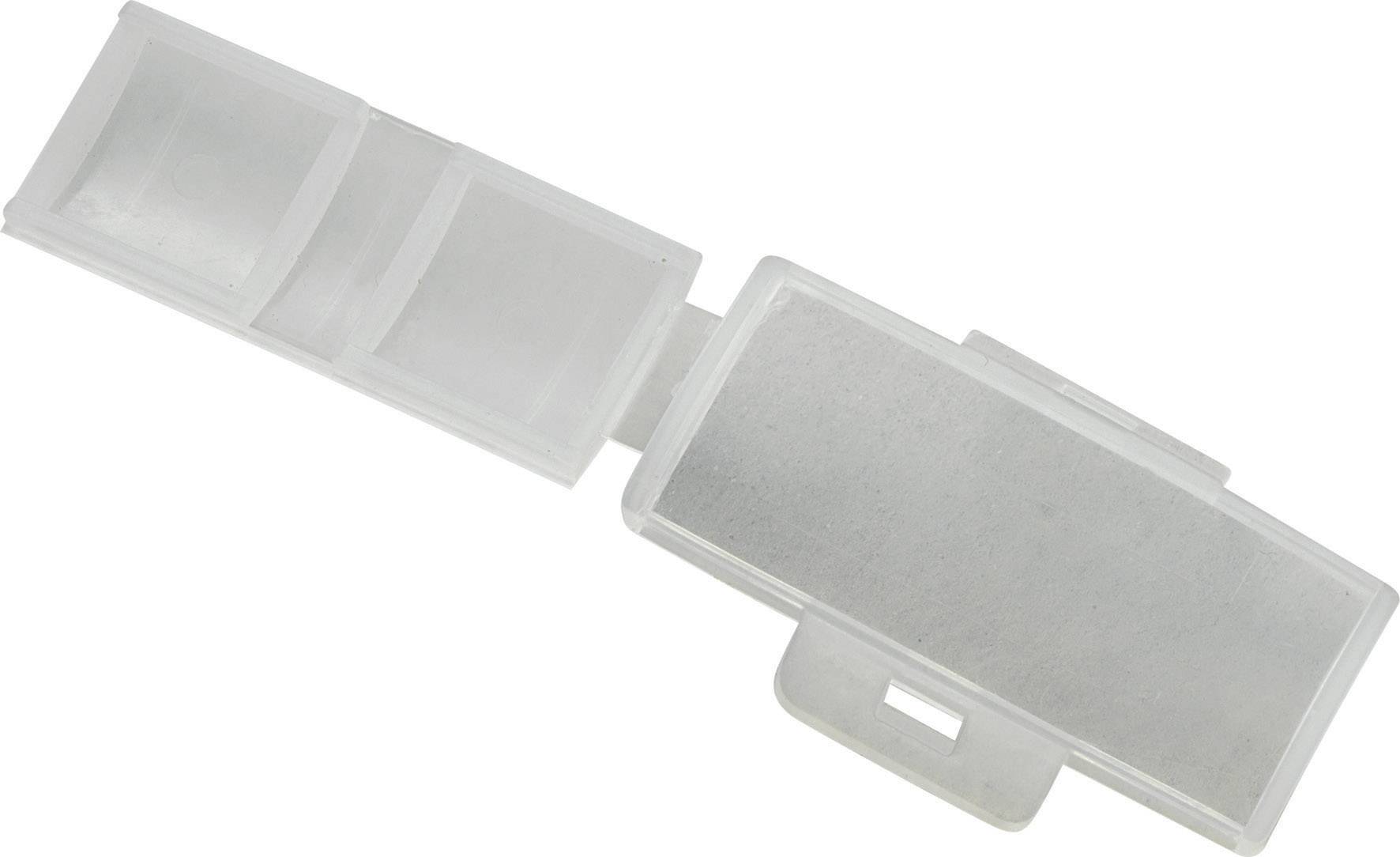 Transparent plastic packaging with two small compartments and one large compartment, opened, empty.