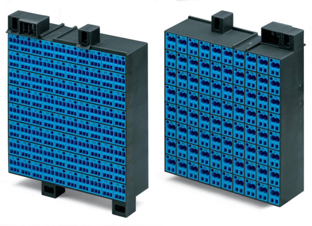 Two black electronic modules with blue connection terminals on the front, standing upright. They appear to be part of a larger system.