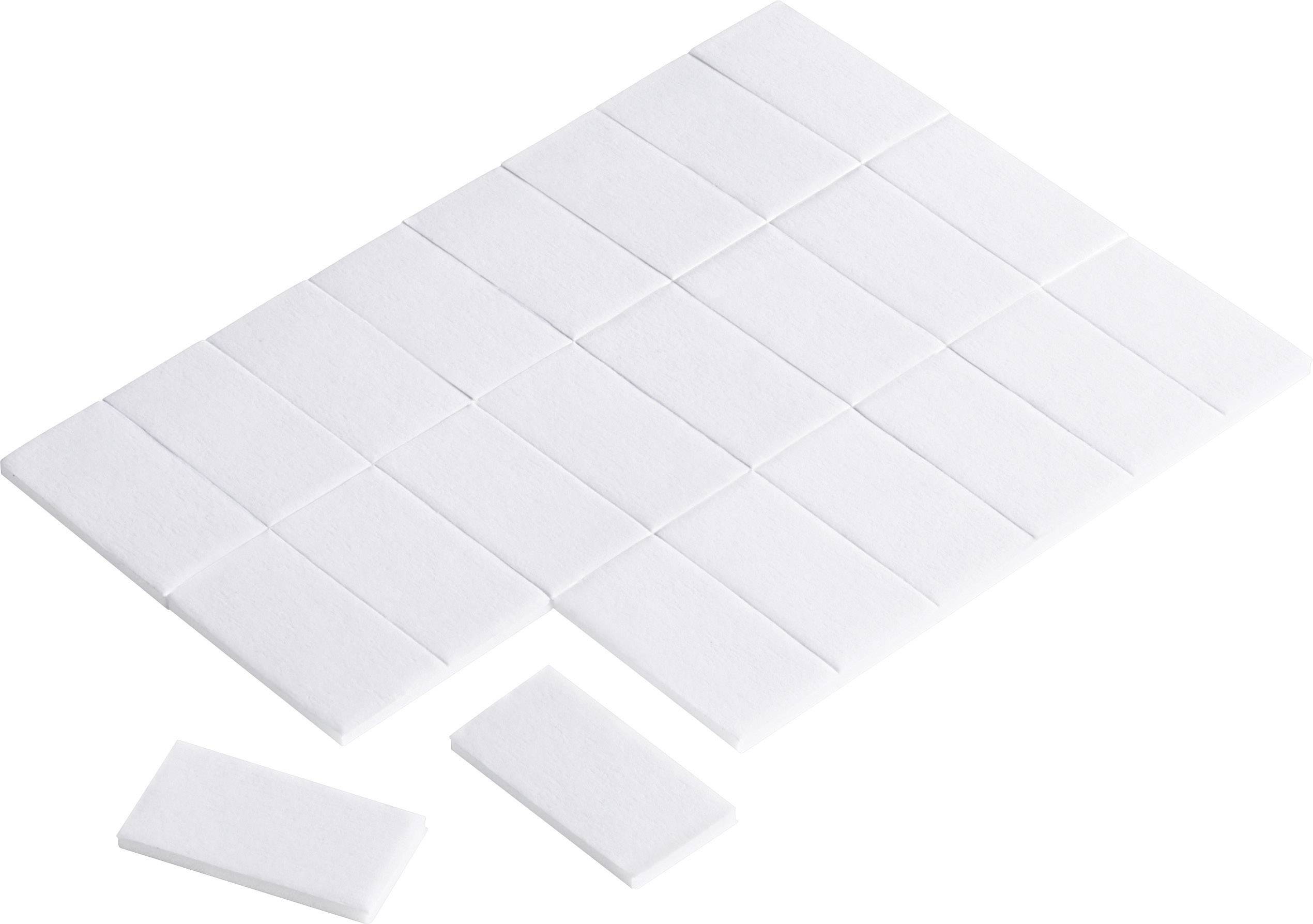 A set of white, rectangular felt furniture glides. Perfect for protecting floors from scratches and reducing noise.
