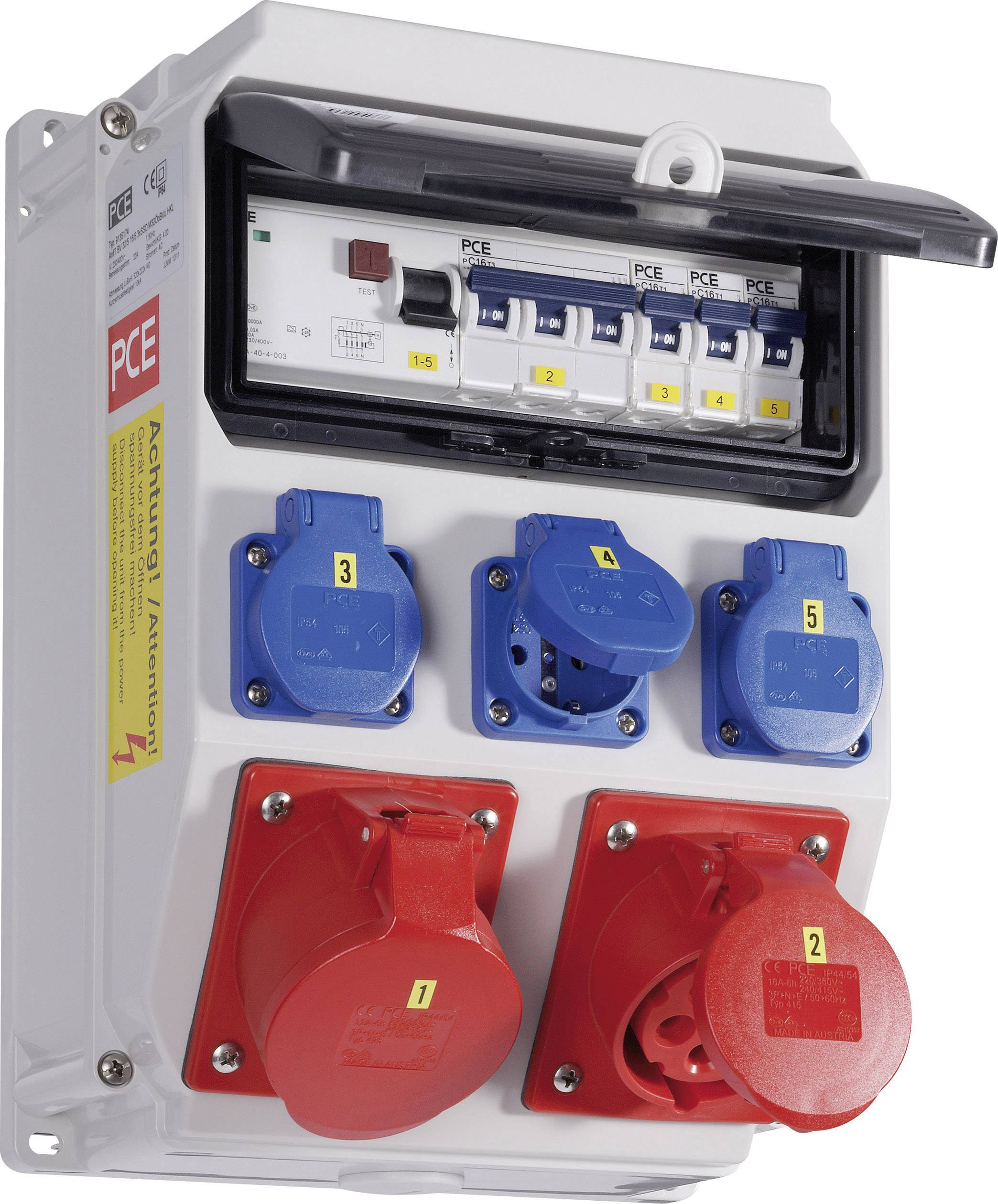 An electrical switchboard enclosure with several blue and red sockets, including toggle switches. Yellow warning label on the side.