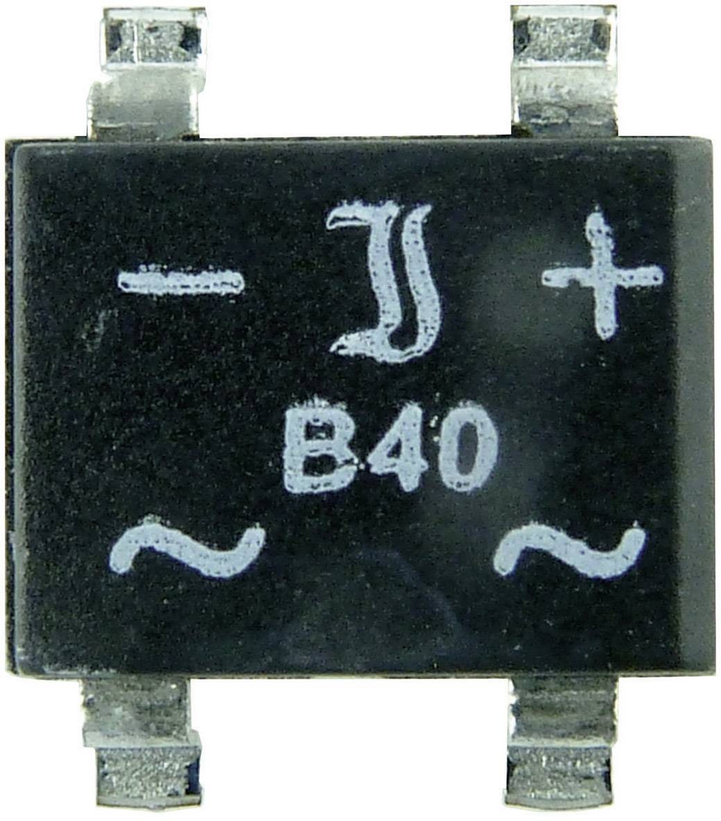 Black electronic component with white marking, indicating polarity and current direction signs.