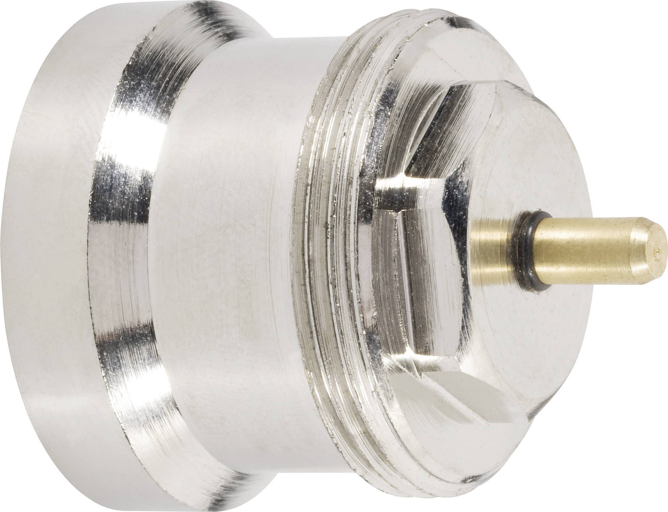 Metallic adapter with a circular base and a protruding nozzle or pin, likely for technical applications.