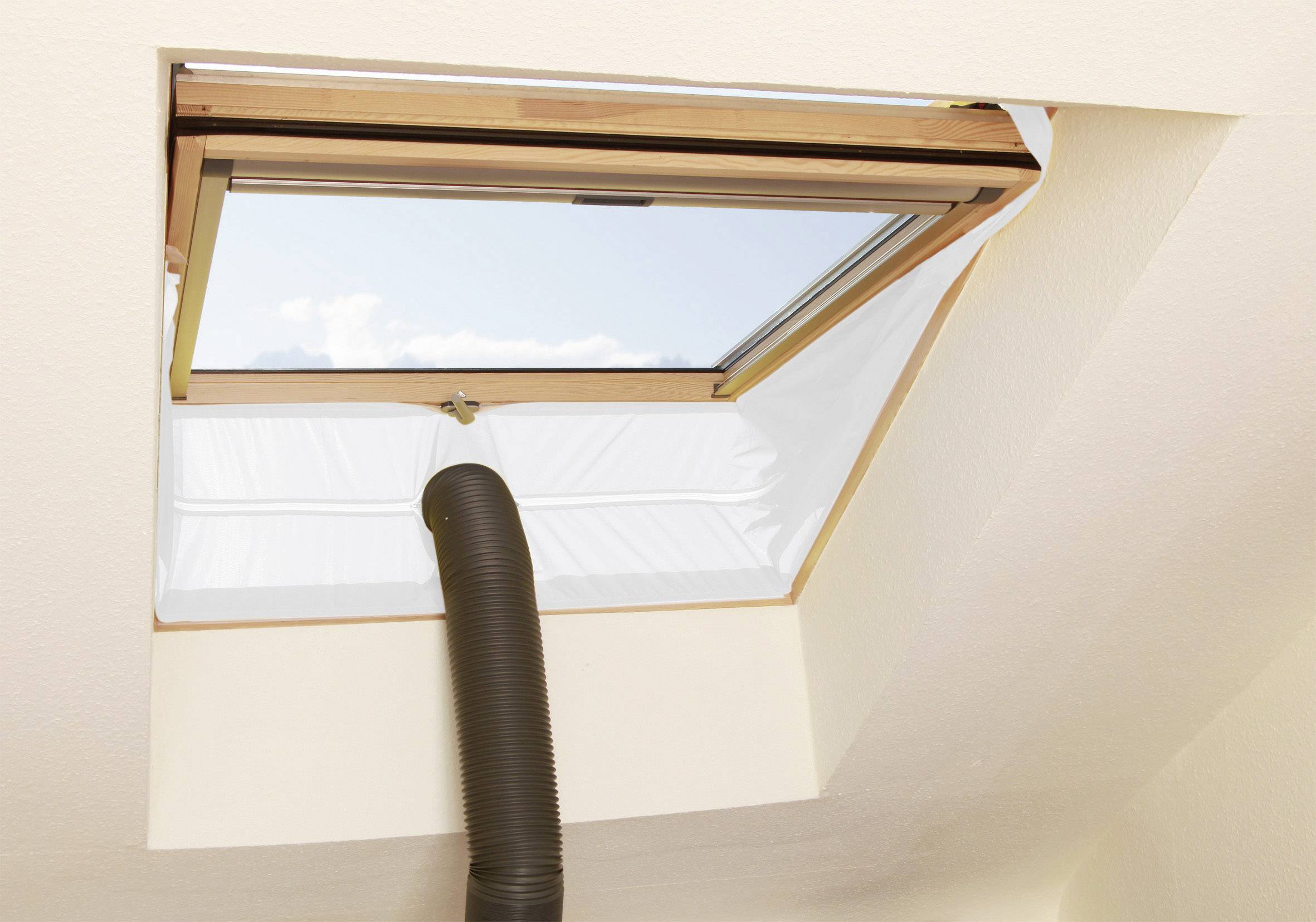 Window with an open frame and a black hose pointing inwards. Blue sky is visible through the window.