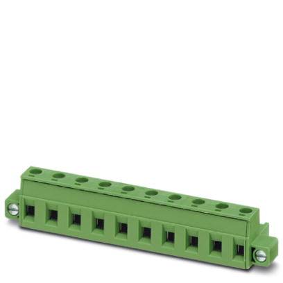 A green connector with eight connection points, lying on a white surface. Suitable for electrical connections.