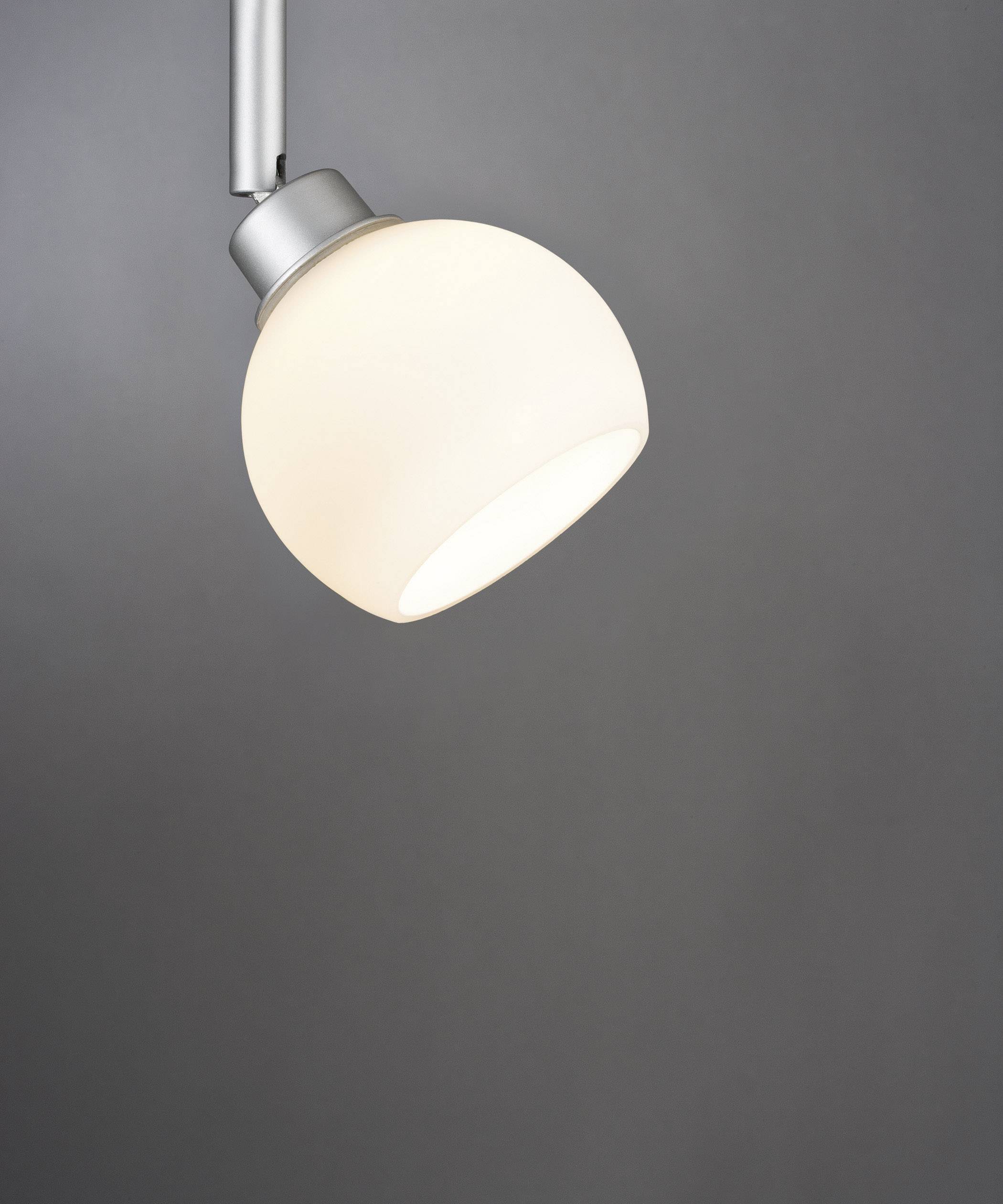A contemporary, spherical pendant light with a white, frosted shade against a grey background. It emits soft light.