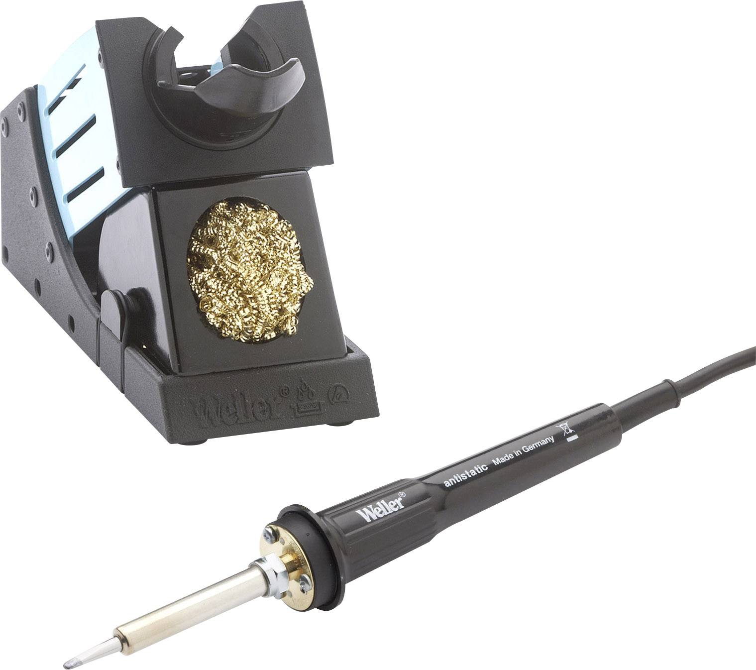 A soldering station with a soldering iron on it. The stand has brass wool for cleaning the tip.