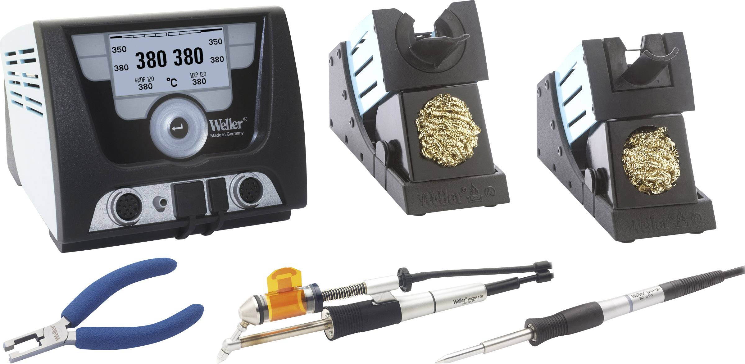 Soldering station with temperature display and two holders, metal cleaning balls; pliers, soldering tips and accessories in the foreground.