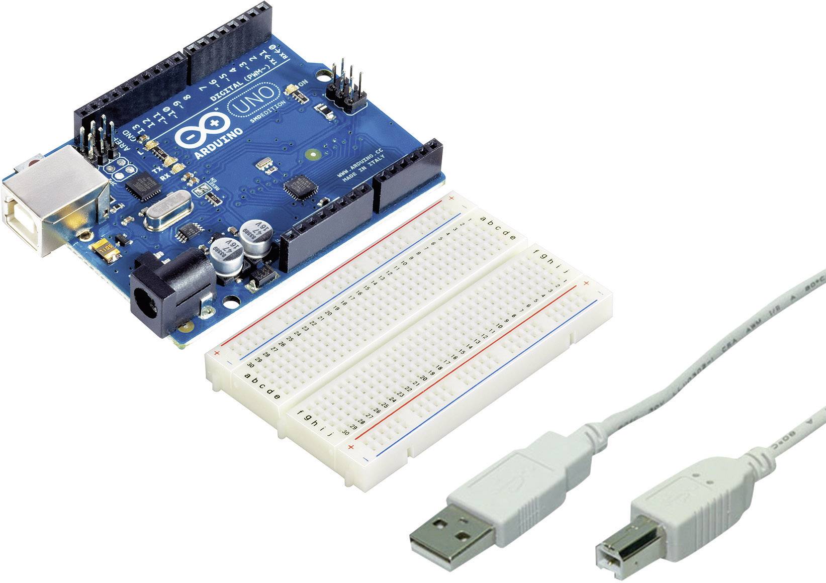 Arduino board with breadboard and USB cable; Ideal for electronics projects and prototyping.