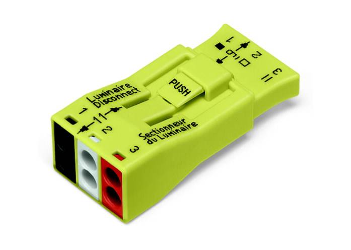 A yellow electrical terminal block with the inscriptions 'Luminaire', 'Dismonter', and 'Sectionneur du Luminaire', with colour markings.
