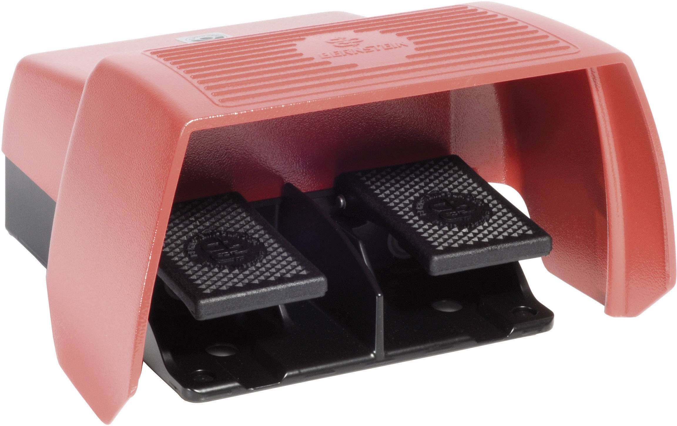 A red, double foot pedal with protective cover, used for controlling machines or devices by foot operation.