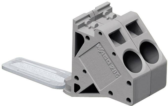 A grey, rectangular component with two circular openings and a protruding flap on the left.