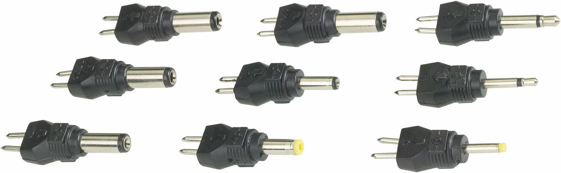 Various black power supply plugs with different plug types and sizes, arranged in two rows.